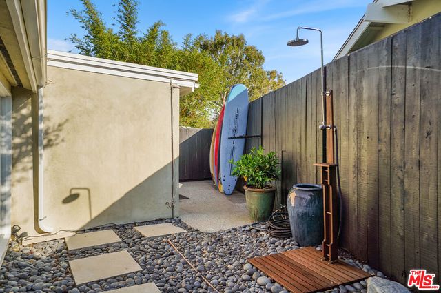 a bathroom with a toilet and a shower curtain
