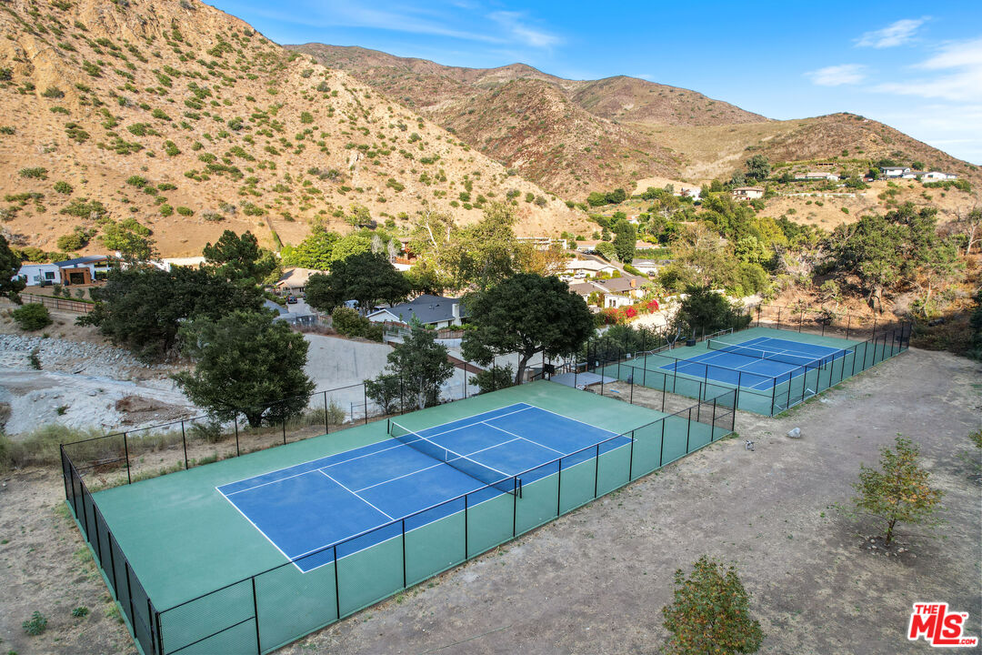 30725 Manzano Drive Malibu, CA 90265 - Photo 51 of 51 a view of a tennis court with a mountain in the background