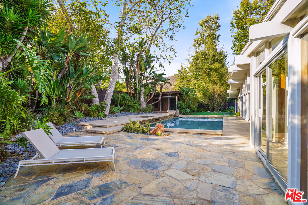 30725 Manzano Drive Malibu, CA 90265 - Photo 7 of 51 a view of backyard with swimming pool and seating space