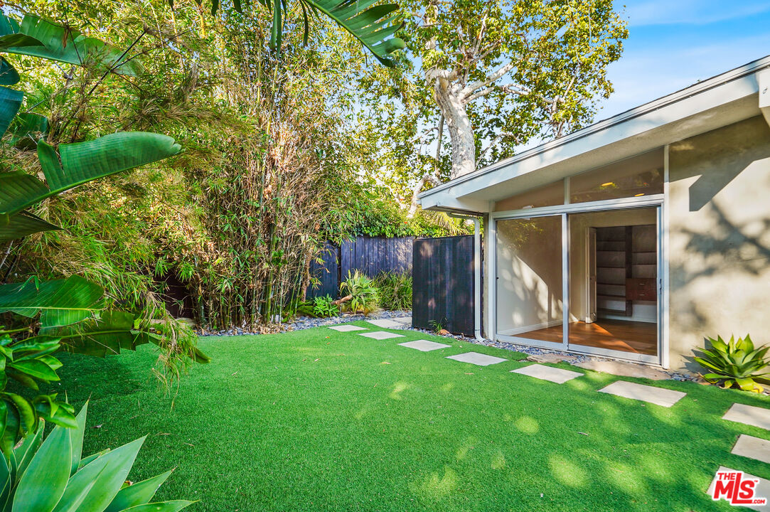30725 Manzano Drive Malibu, CA 90265 - Photo 10 of 51 a view of a house with backyard and a tree
