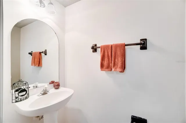a bathroom with a sink and mirror