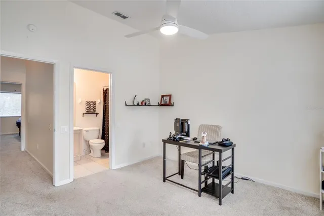 a view of a workspace with furniture