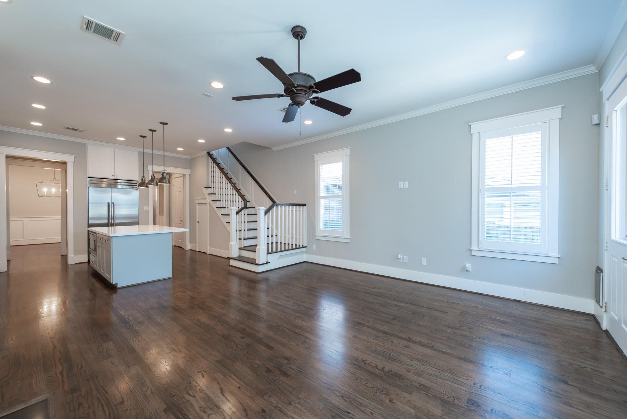 734 Allston Street, Unit B Houston, TX 77007 - Photo 11 of 28 This room is very light and bright with all the natural light that flows in. This lovely area features recessed ldighting, ceiling fan, custom paint, built-in shelving and a gas fireplace.