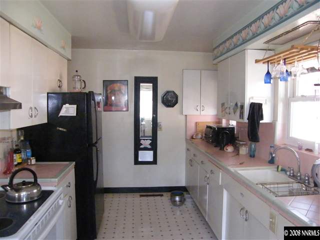 1495 Wright Street Reno, NV 89509 - Photo 6 of 9 a kitchen with stainless steel appliances granite countertop a refrigerator and a sink