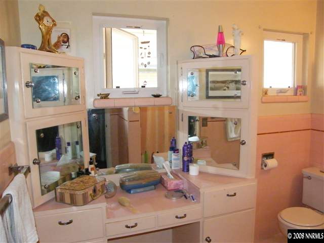 1495 Wright Street Reno, NV 89509 - Photo 8 of 9 a bathroom with a sink and a mirror