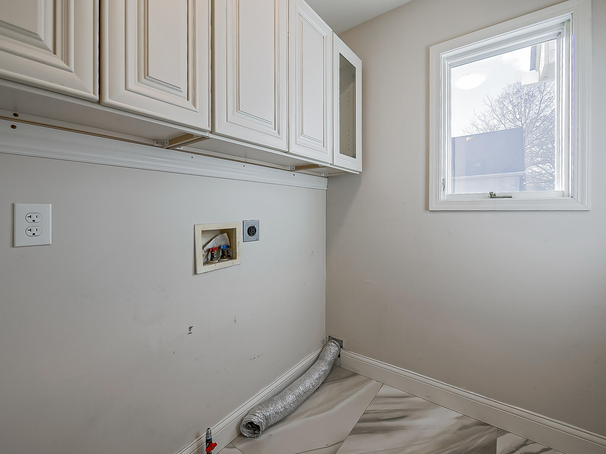 3345 East Commerce Road Commerce Township, MI 48382 - Photo 34 of 53 1st floor laundry