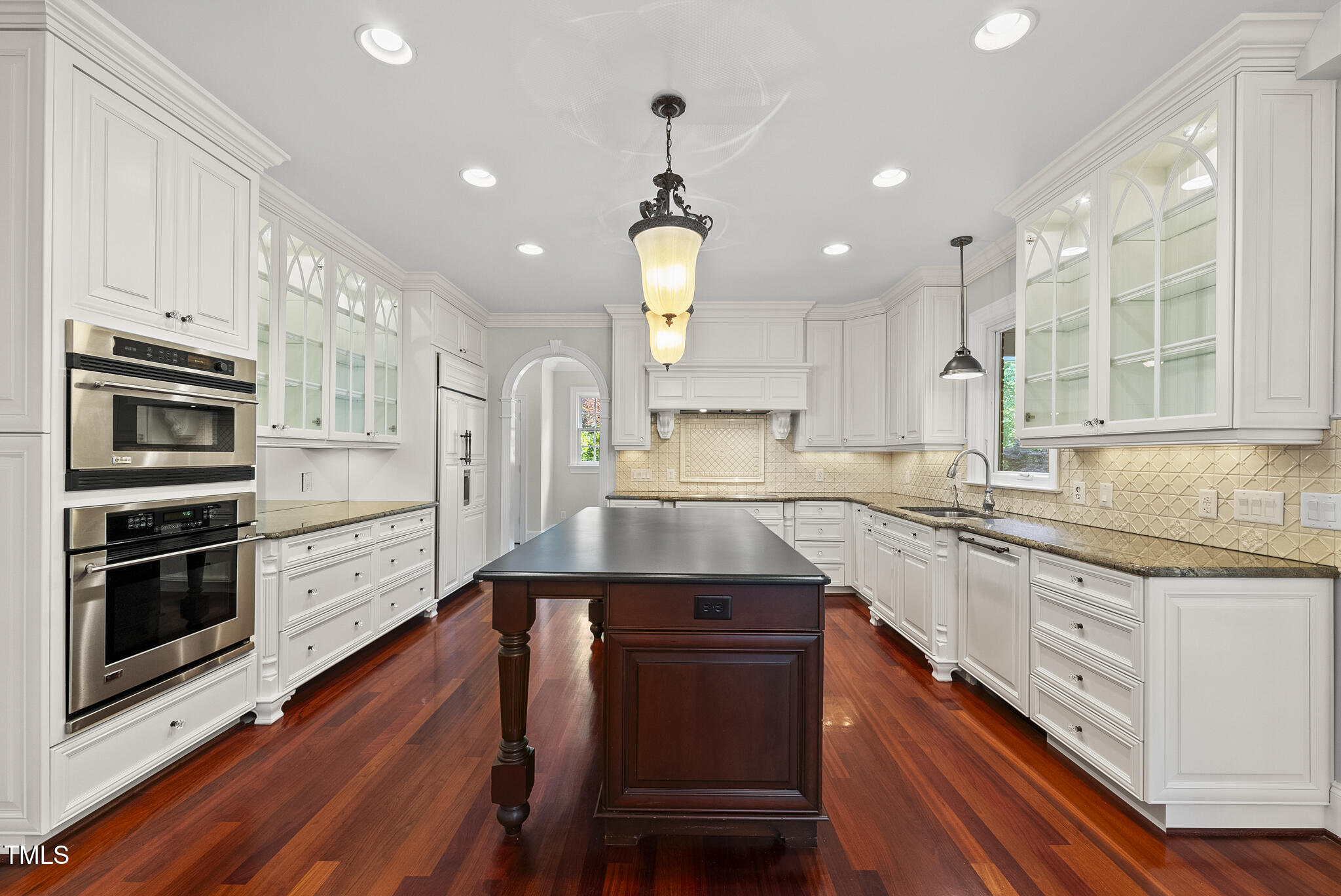 10825 Rondeau Woods Court Raleigh, NC 27614 - Photo 9 of 65 a kitchen with a sink stainless steel appliances and cabinets