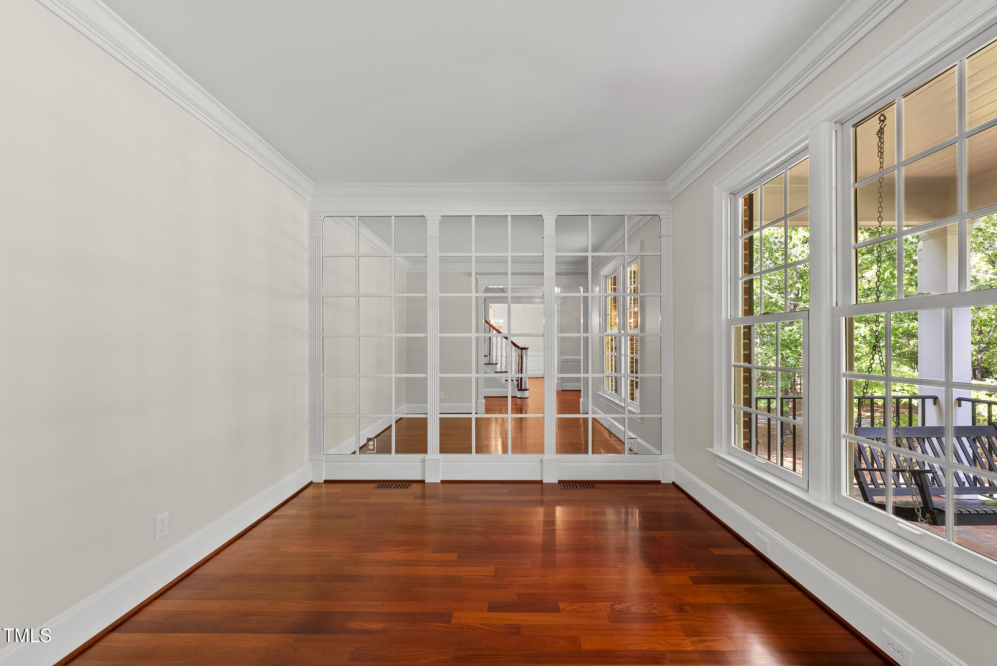 10825 Rondeau Woods Court Raleigh, NC 27614 - Photo 16 of 65 a view of empty room with wooden floor and fan