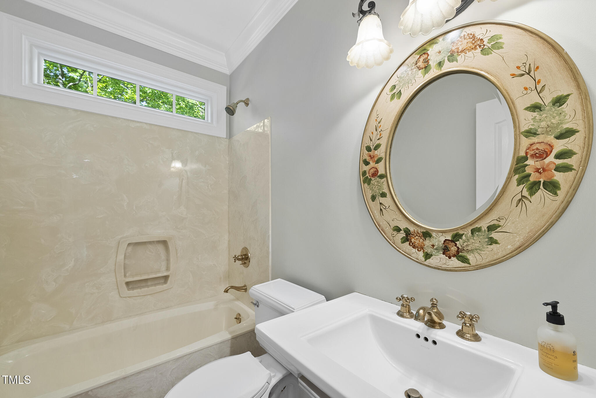 10825 Rondeau Woods Court Raleigh, NC 27614 - Photo 19 of 65 a bathroom with a bathtub and mirror