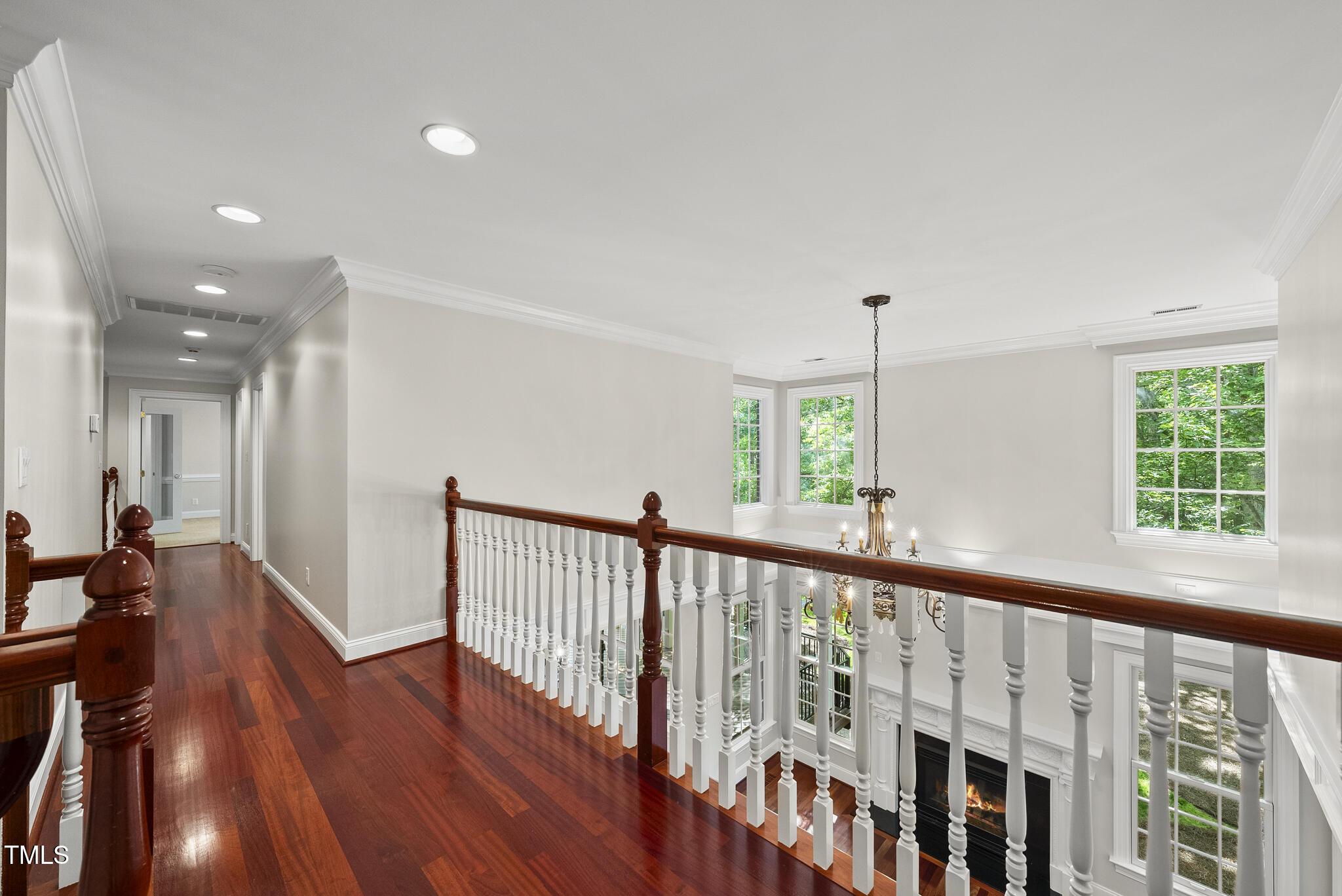 10825 Rondeau Woods Court Raleigh, NC 27614 - Photo 20 of 65 a view of hallway with wooden floor and windows