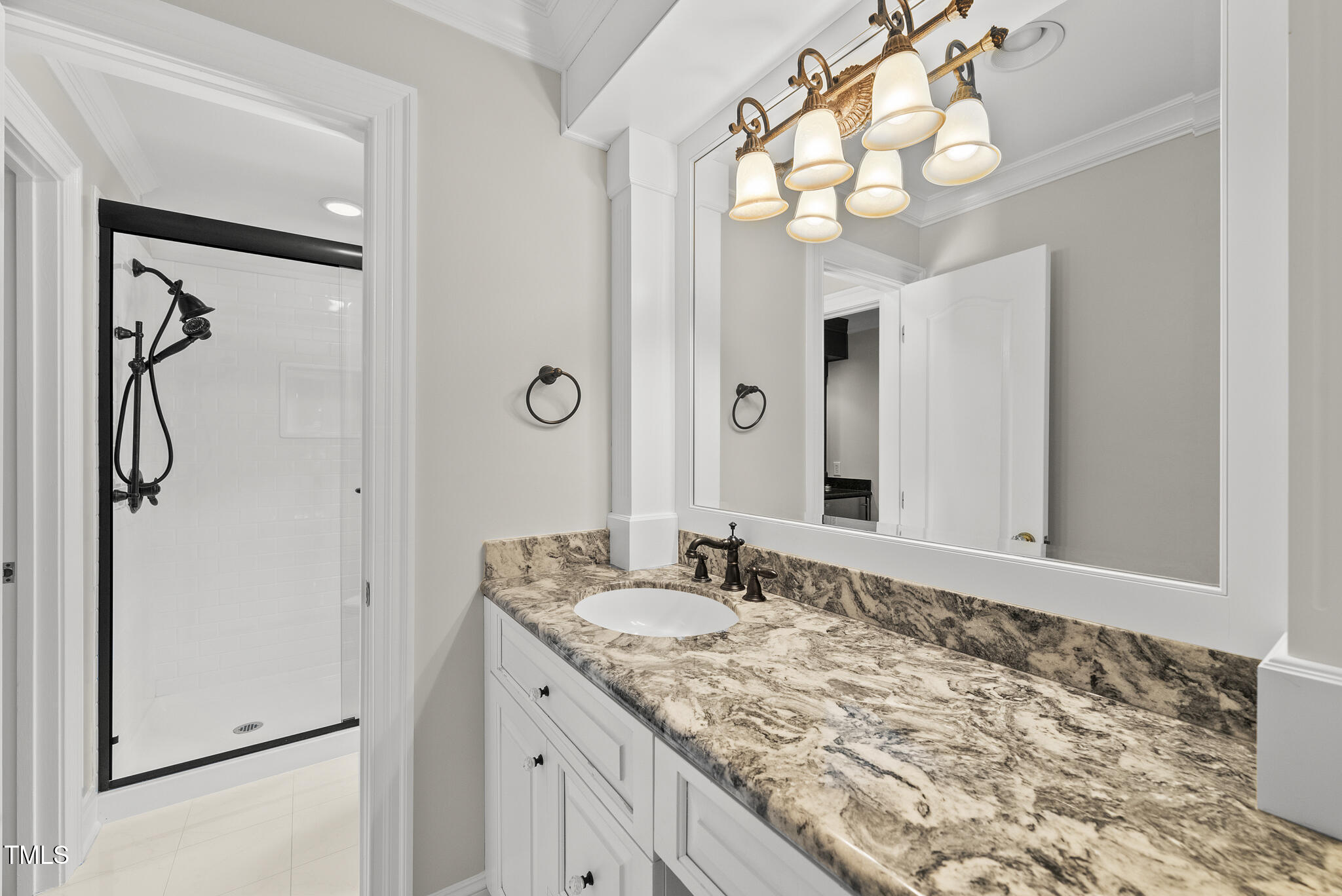 10825 Rondeau Woods Court Raleigh, NC 27614 - Photo 35 of 65 a bathroom with a granite countertop sink two mirror and shower