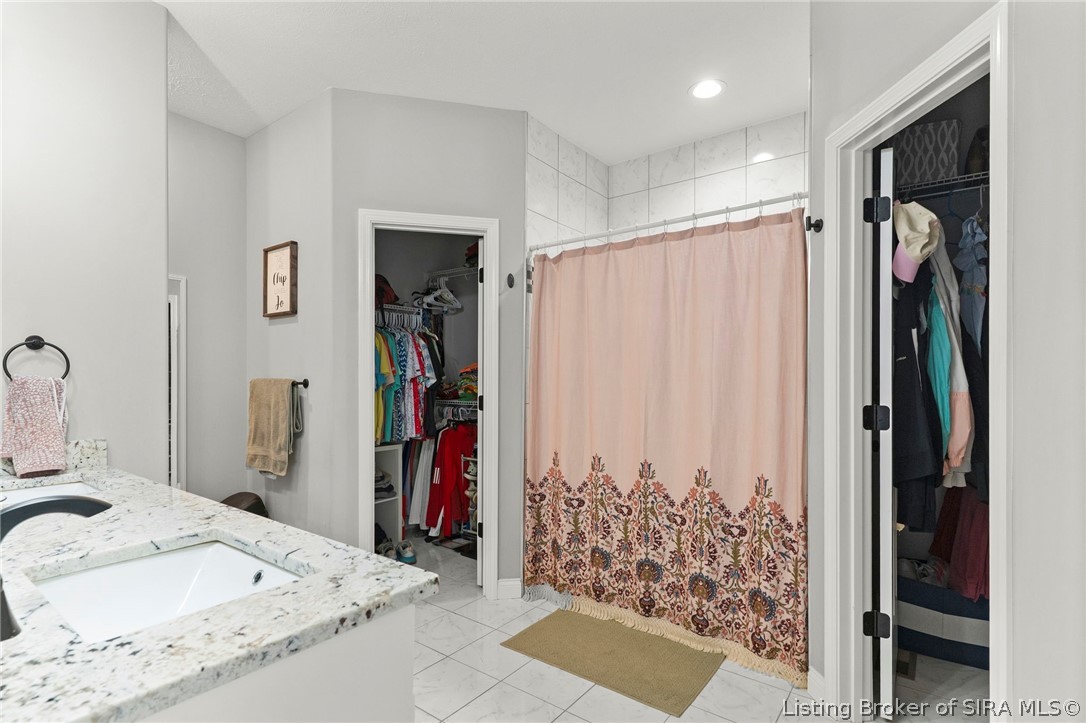 68 South W Paine Street Hanover, IN 47243 - Photo 18 of 27 Primary Bedroom with Ensuite bathroom with two additional walk in closets and double sinks in vanity. Also large shower