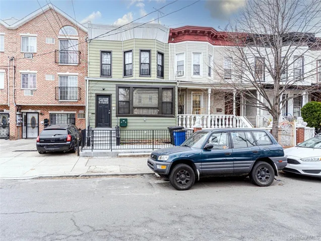 a view of a car parked in front of a building