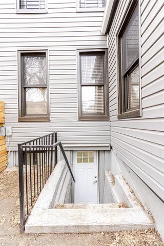 a view of a house with wooden deck