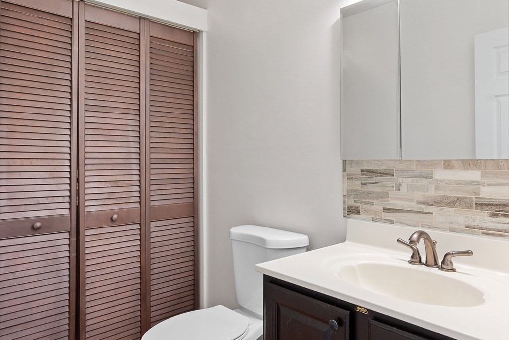 25 Century Way, Unit 25 Gardner, MA 01440 - Photo 12 of 34 a bathroom with a sink a toilet and mirror