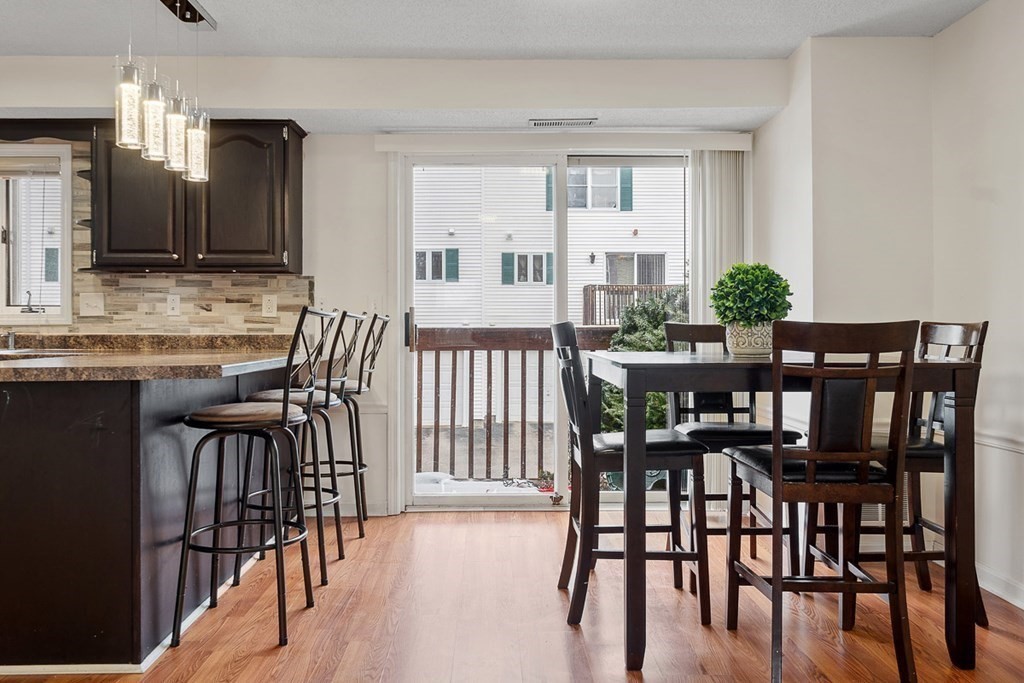 25 Century Way, Unit 25 Gardner, MA 01440 - Photo 14 of 34 a view of a dining room with furniture and wooden floor