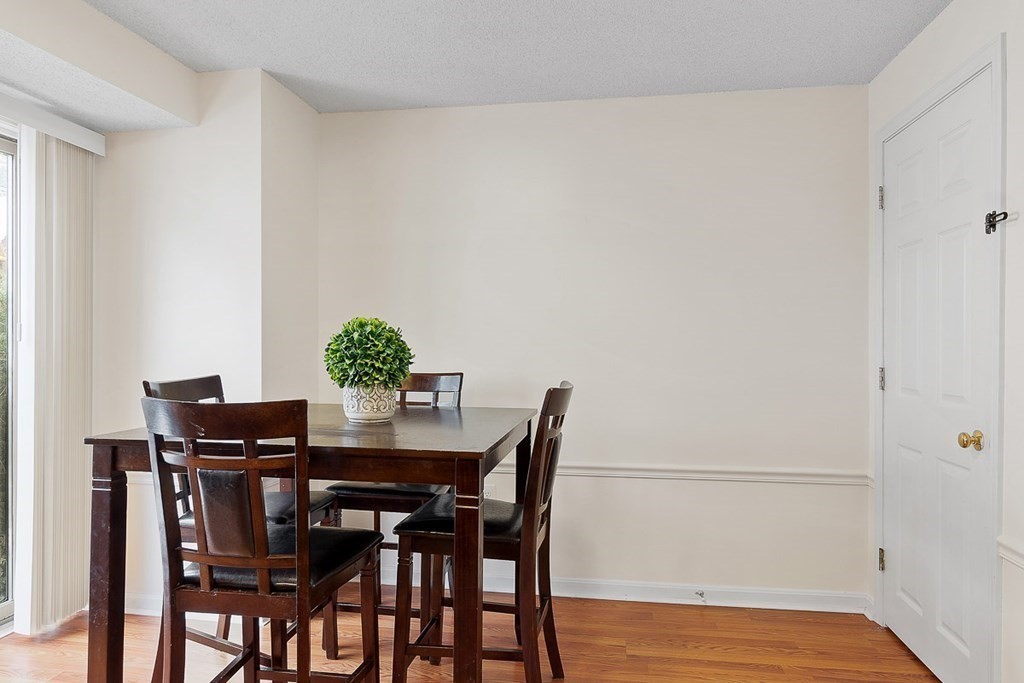25 Century Way, Unit 25 Gardner, MA 01440 - Photo 16 of 34 a dining room with furniture and wooden floor