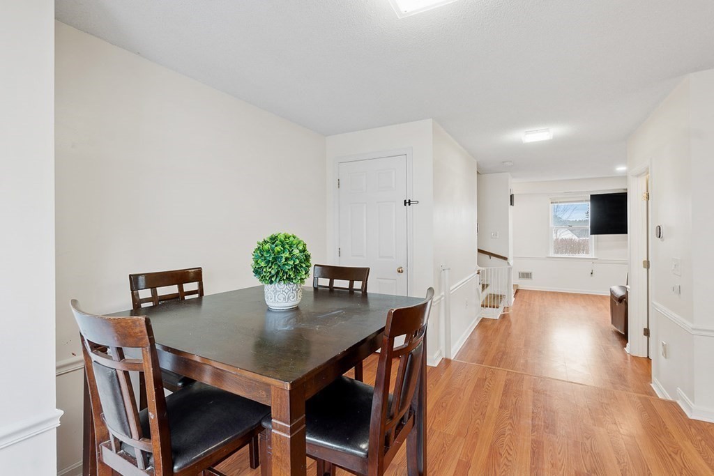 25 Century Way, Unit 25 Gardner, MA 01440 - Photo 17 of 34 a view of a dining room with furniture and wooden floor