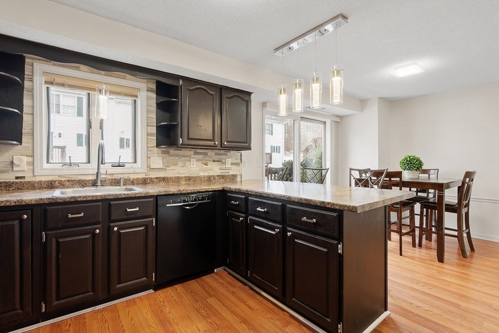 25 Century Way, Unit 25 Gardner, MA 01440 - Photo 21 of 34 a kitchen with a sink and cabinets