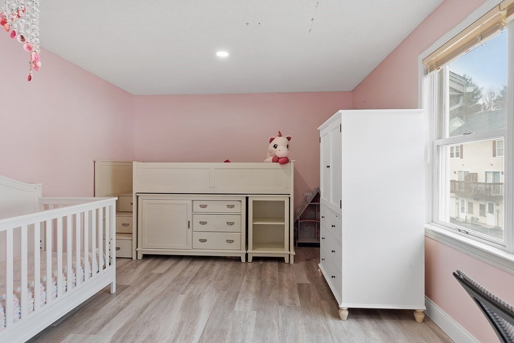 25 Century Way, Unit 25 Gardner, MA 01440 - Photo 27 of 34 a bedroom with a bed and a dresser
