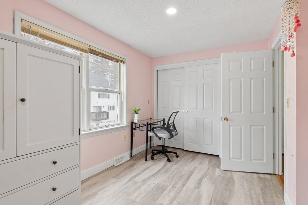 25 Century Way, Unit 25 Gardner, MA 01440 - Photo 28 of 34 a view of a room with wooden floor and windows