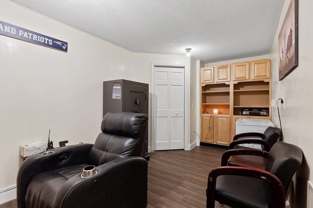 25 Century Way, Unit 25 Gardner, MA 01440 - Photo 30 of 34 a living room with furniture and a air conditioner vent
