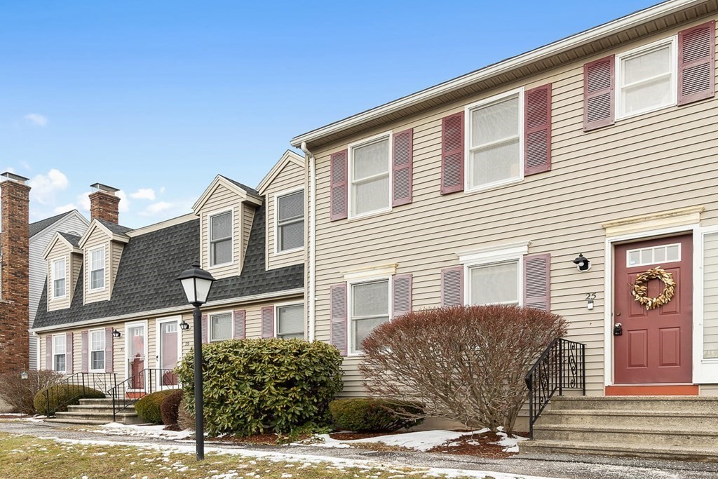 25 Century Way, Unit 25 Gardner, MA 01440 - Photo 3 of 34 a front view of a house with a yard