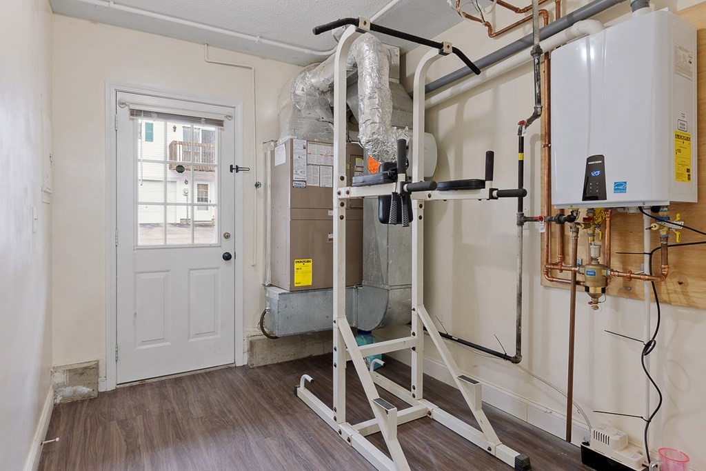 25 Century Way, Unit 25 Gardner, MA 01440 - Photo 34 of 34 a view of a room with wooden floor and windows