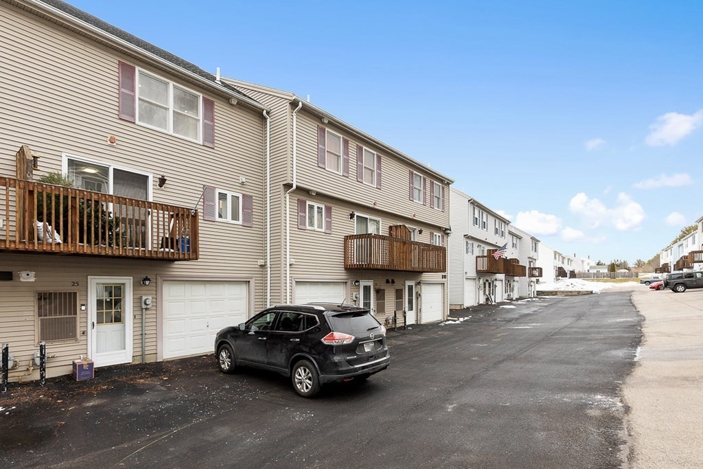 25 Century Way, Unit 25 Gardner, MA 01440 - Photo 4 of 34 a car parked in front of a white building