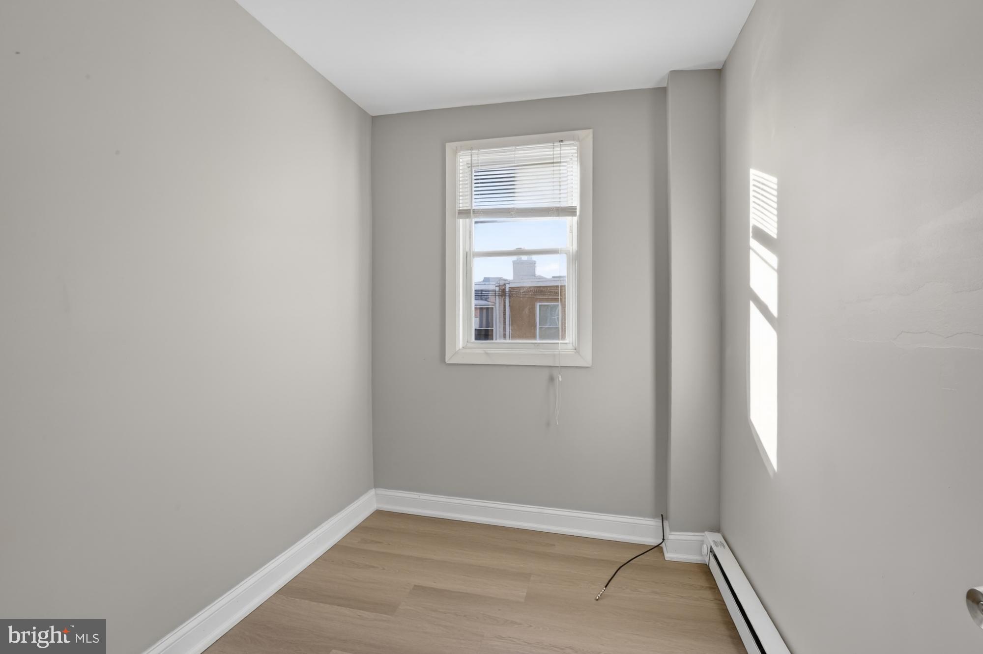 1640 South 28th Street Philadelphia, PA 19145 - Photo 14 of 27 a view of an empty room with closet and a window