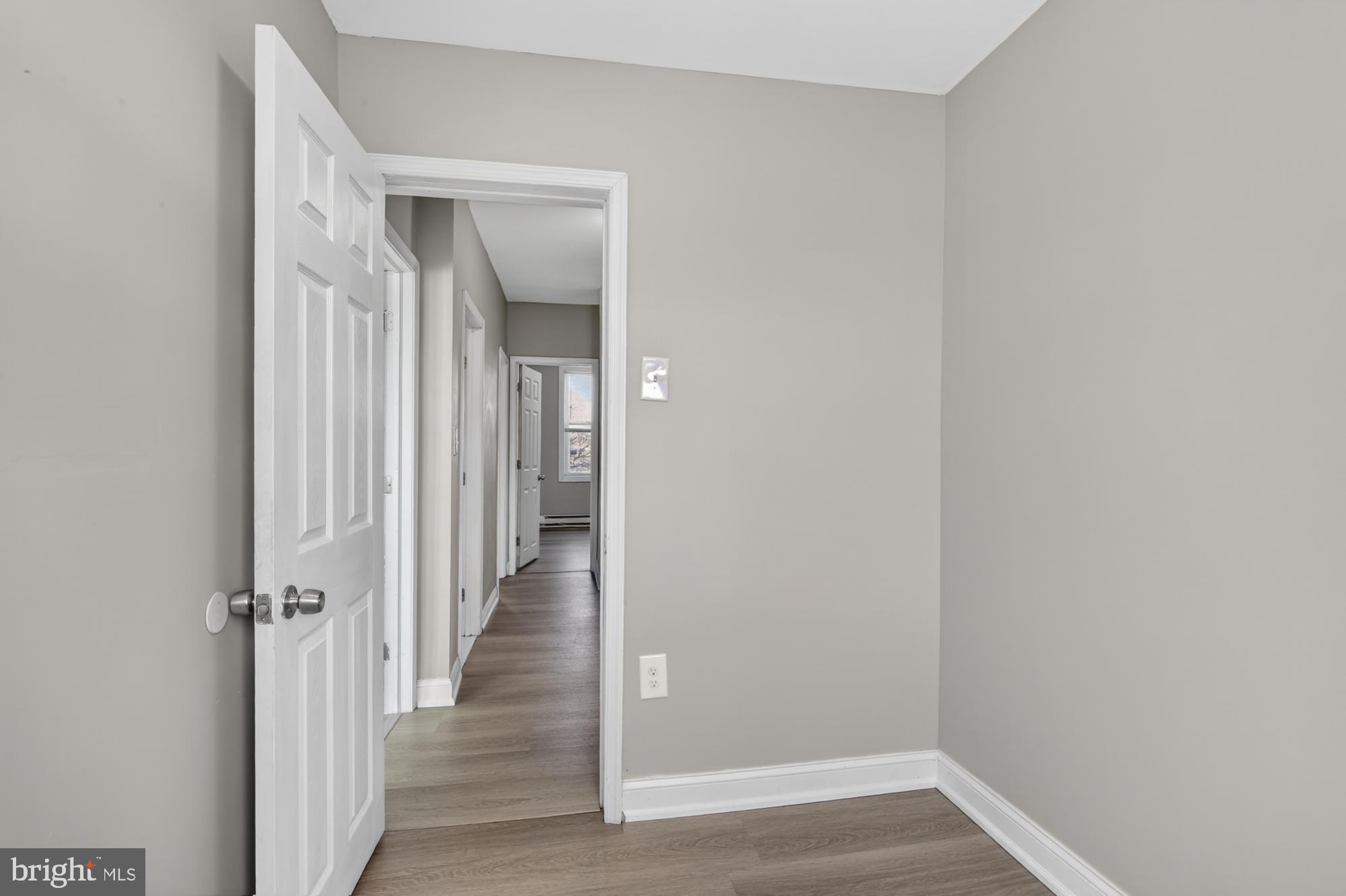 1640 South 28th Street Philadelphia, PA 19145 - Photo 15 of 27 a view of a hallway with wooden floor