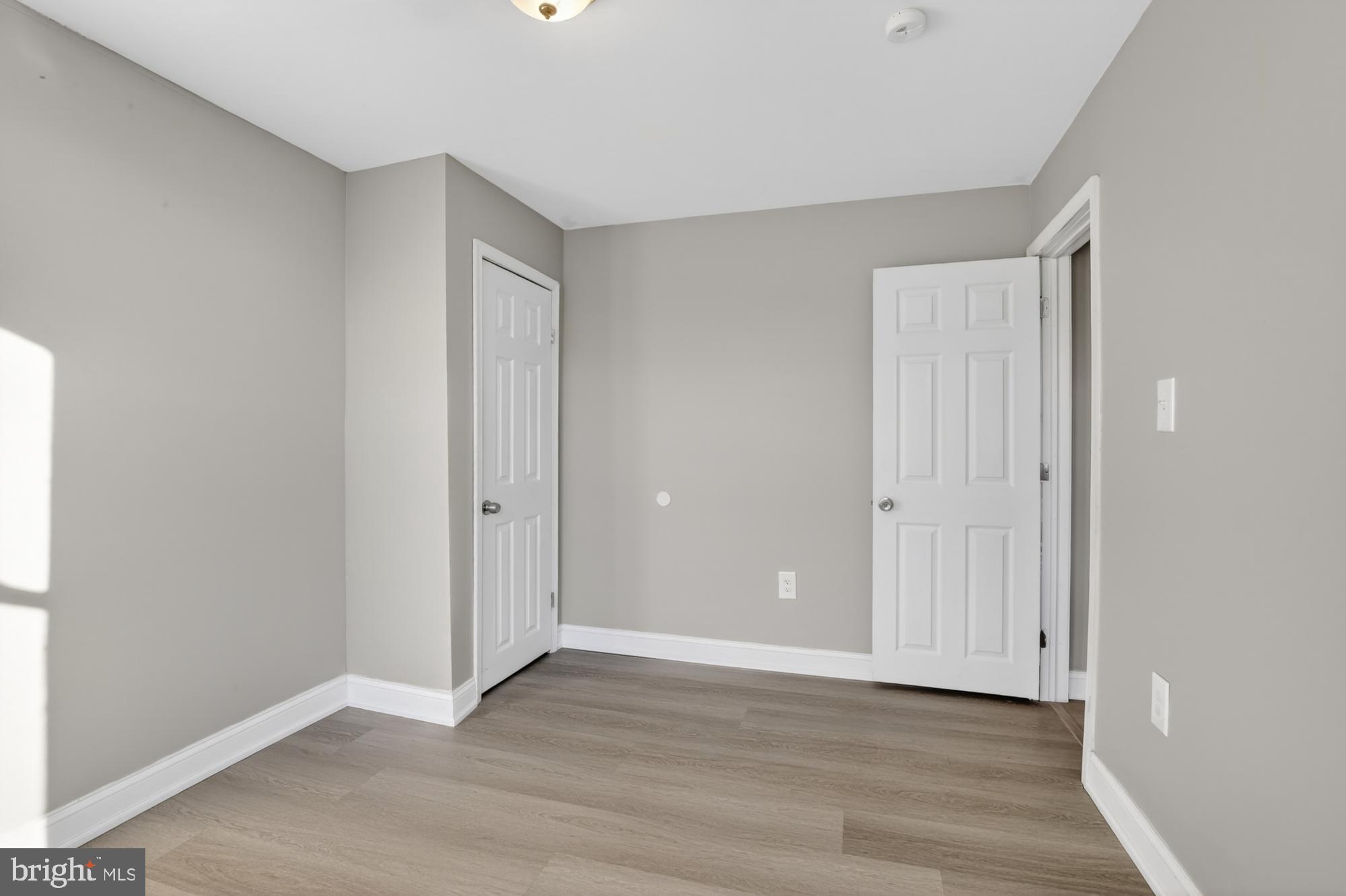 1640 South 28th Street Philadelphia, PA 19145 - Photo 18 of 27 a view of an empty room with wooden floor