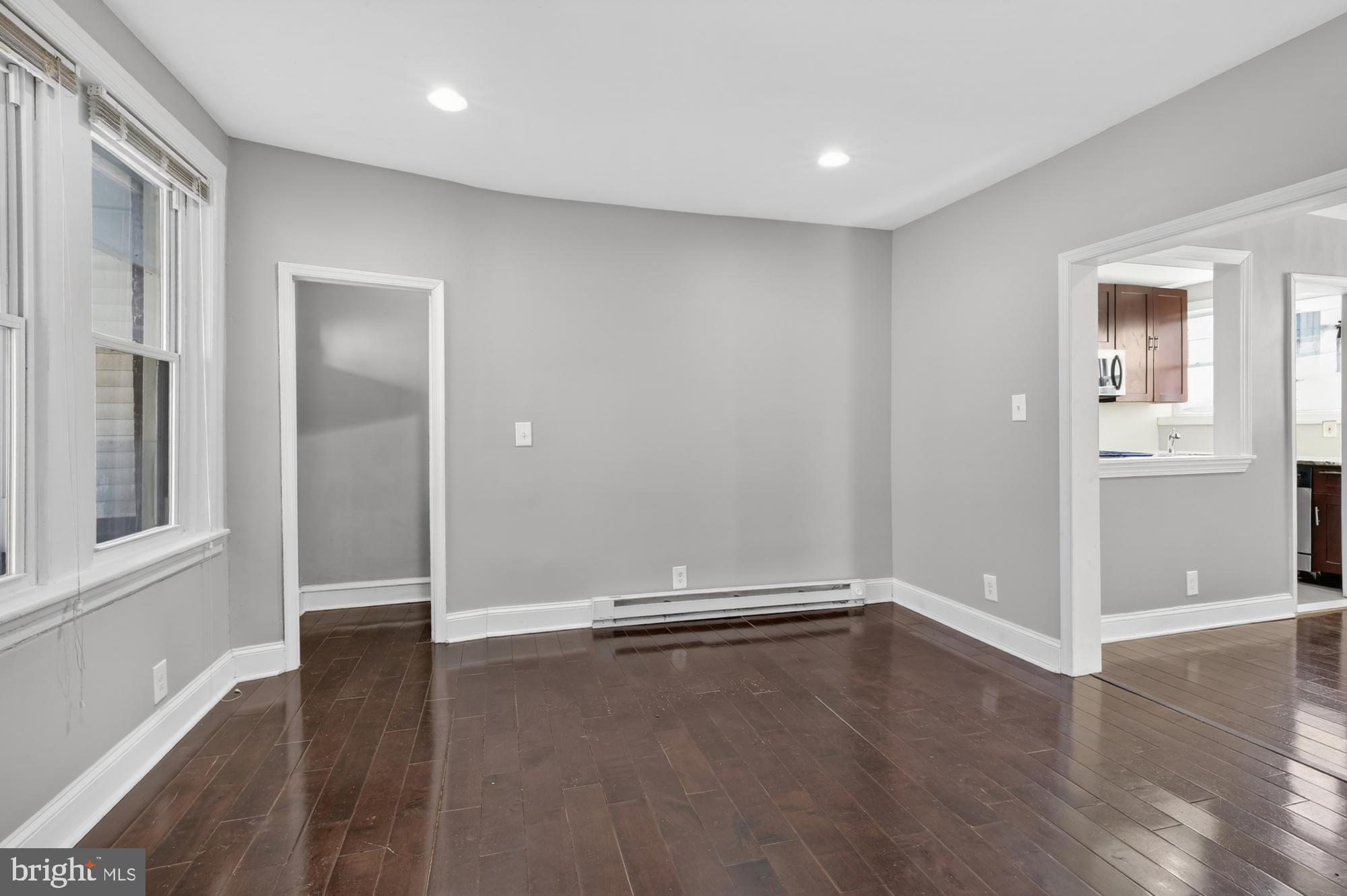 1640 South 28th Street Philadelphia, PA 19145 - Photo 2 of 27 an empty room with wooden floor and windows