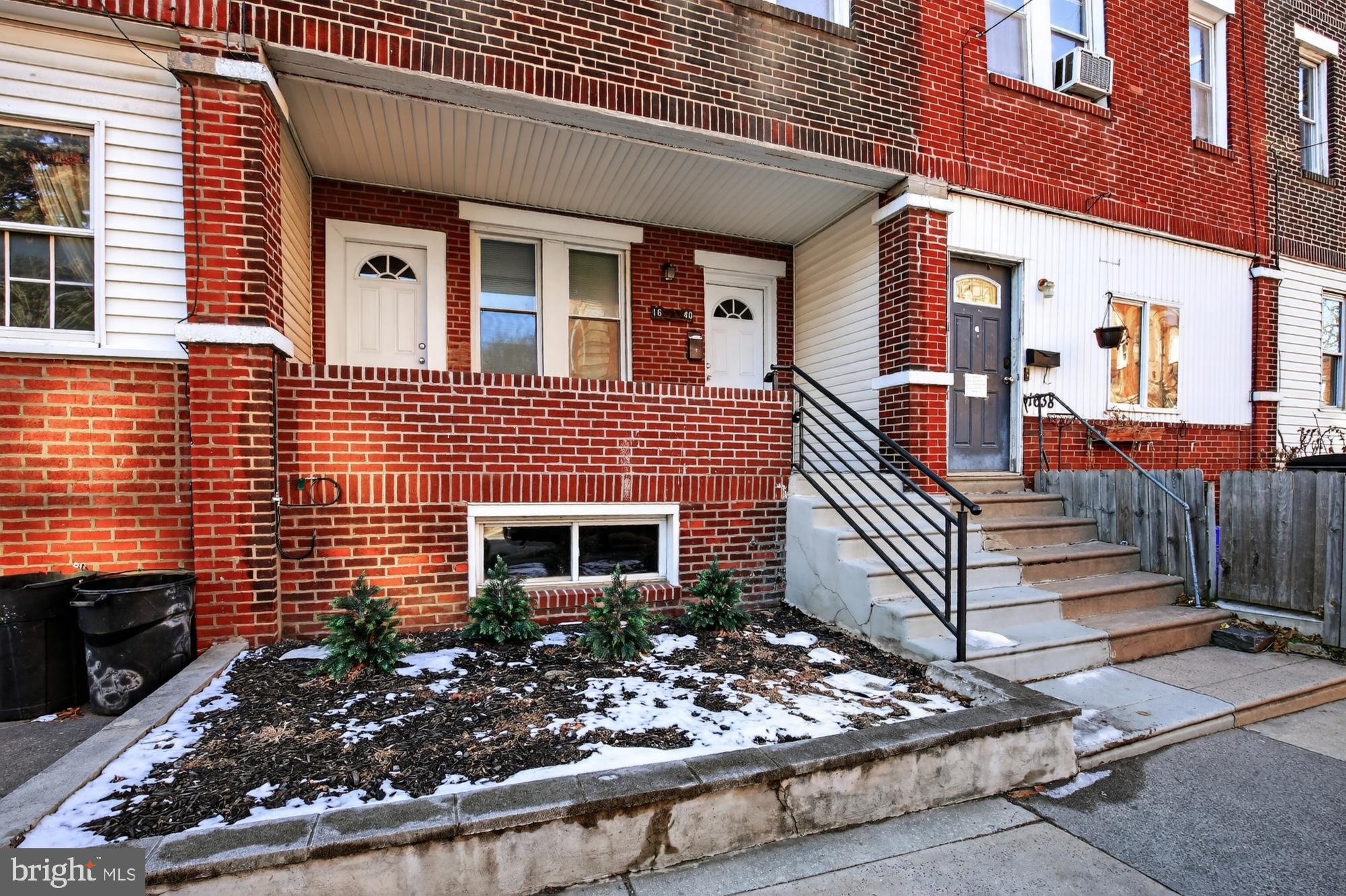 1640 South 28th Street Philadelphia, PA 19145 - Photo 26 of 27 a front view of a house with a large windows
