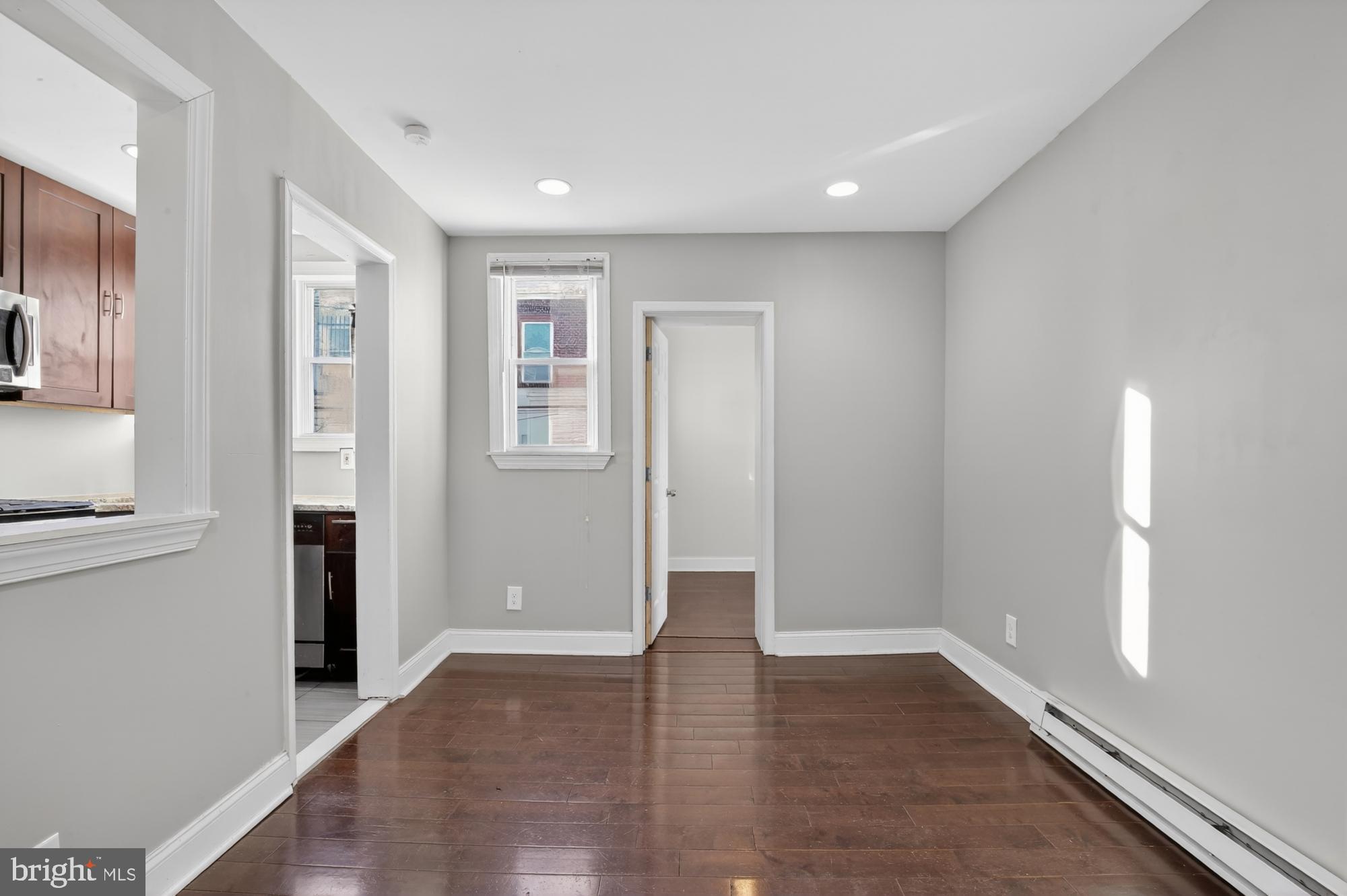 1640 South 28th Street Philadelphia, PA 19145 - Photo 5 of 27 wooden floor in an empty room with a window