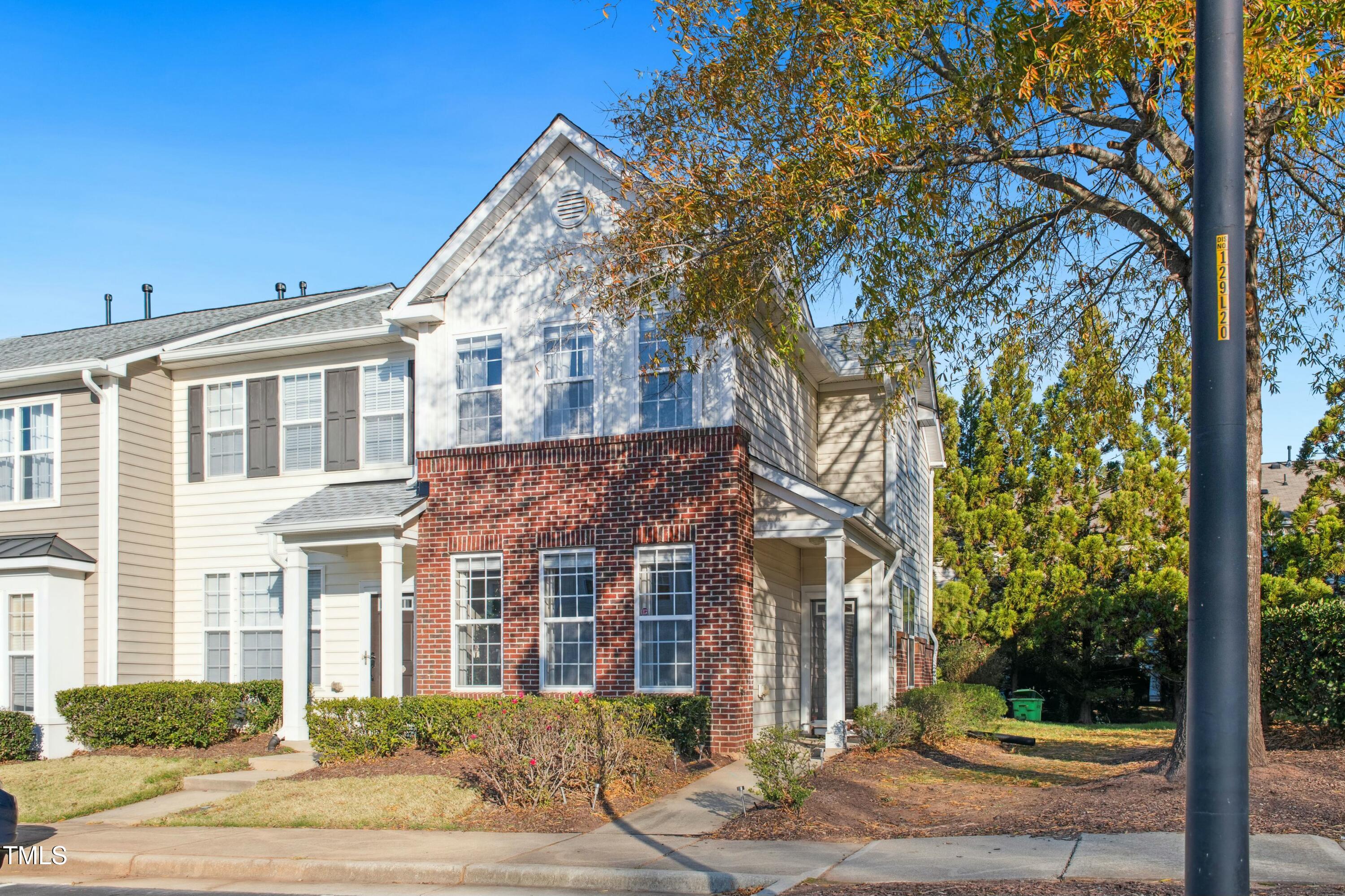 7622 Winners Edge Street Raleigh, NC 27617 - Photo 1 of 26 a view of a big house with large tree and plants
