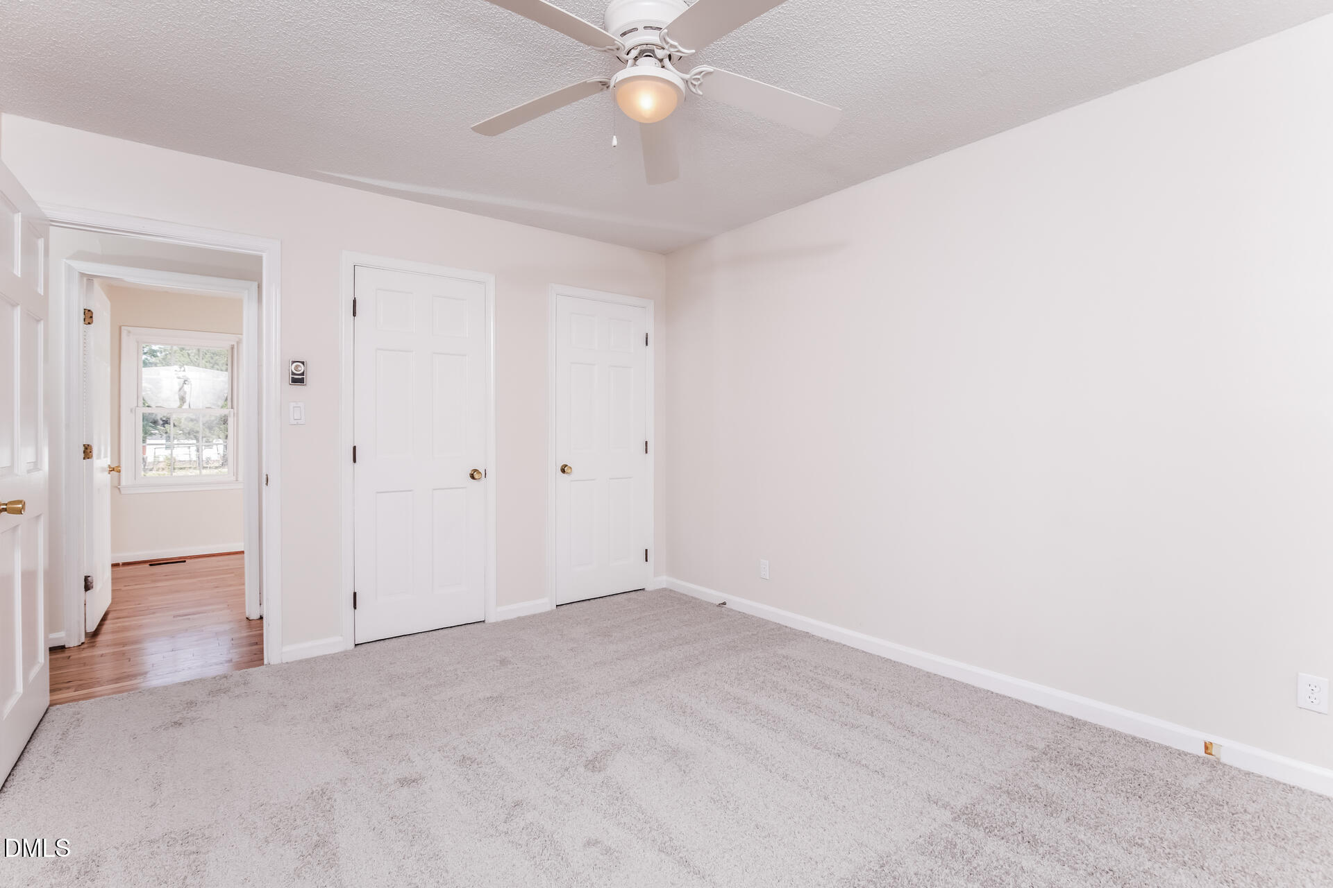 870 Abbott Road Henderson, NC 27537 - Photo 12 of 20 an empty room with fan and entrance