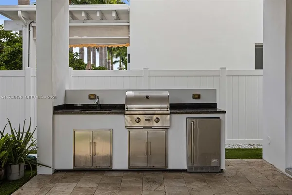 a stove top oven sitting inside of a kitchen