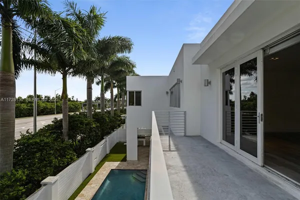 a view of balcony with furniture