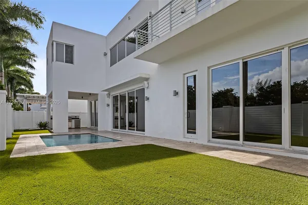 a view of a patio with swimming pool table and chairs