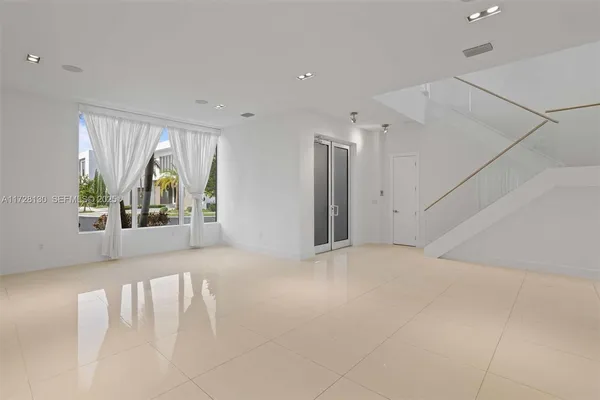 a view of an empty room with a window