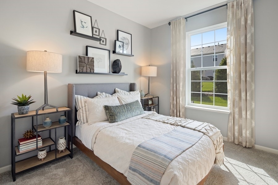 25616 West Springview Drive Plainfield, IL 60586 - Photo 11 of 23 a bedroom with a bed and a night stand