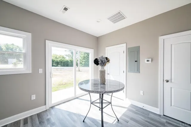 a view of a livingroom with a furniture and wooden floor