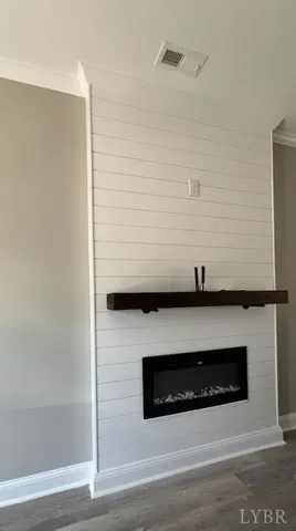 a view of fireplace and wooden floor