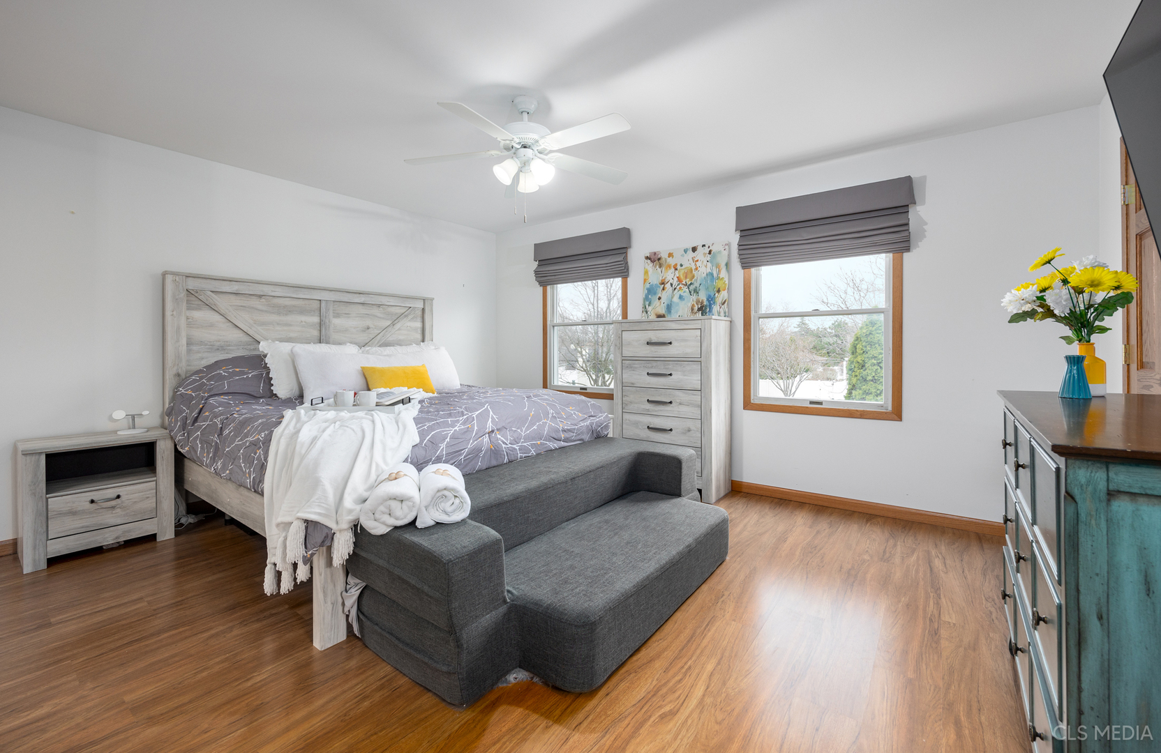2115 Tiffany Drive Schaumburg, IL 60193 - Photo 13 of 23 a bedroom with a bed and wooden floor