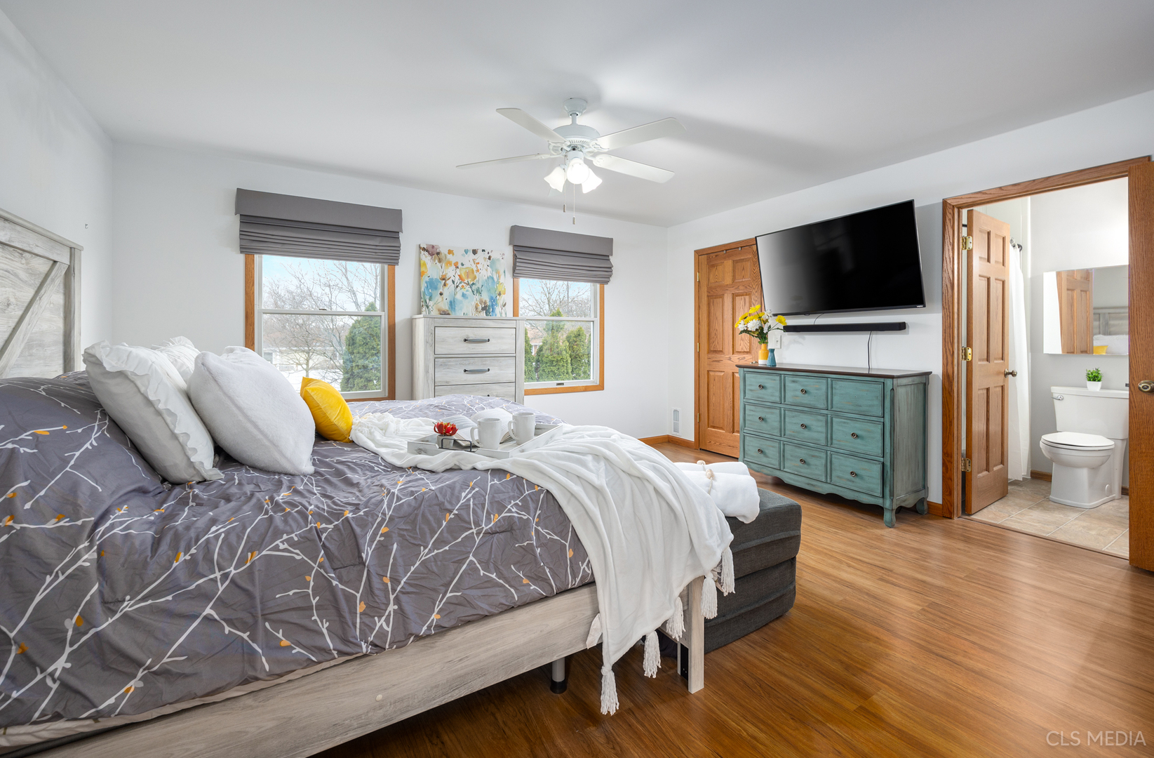 2115 Tiffany Drive Schaumburg, IL 60193 - Photo 14 of 23 a bedroom with a large bed and a flat screen tv