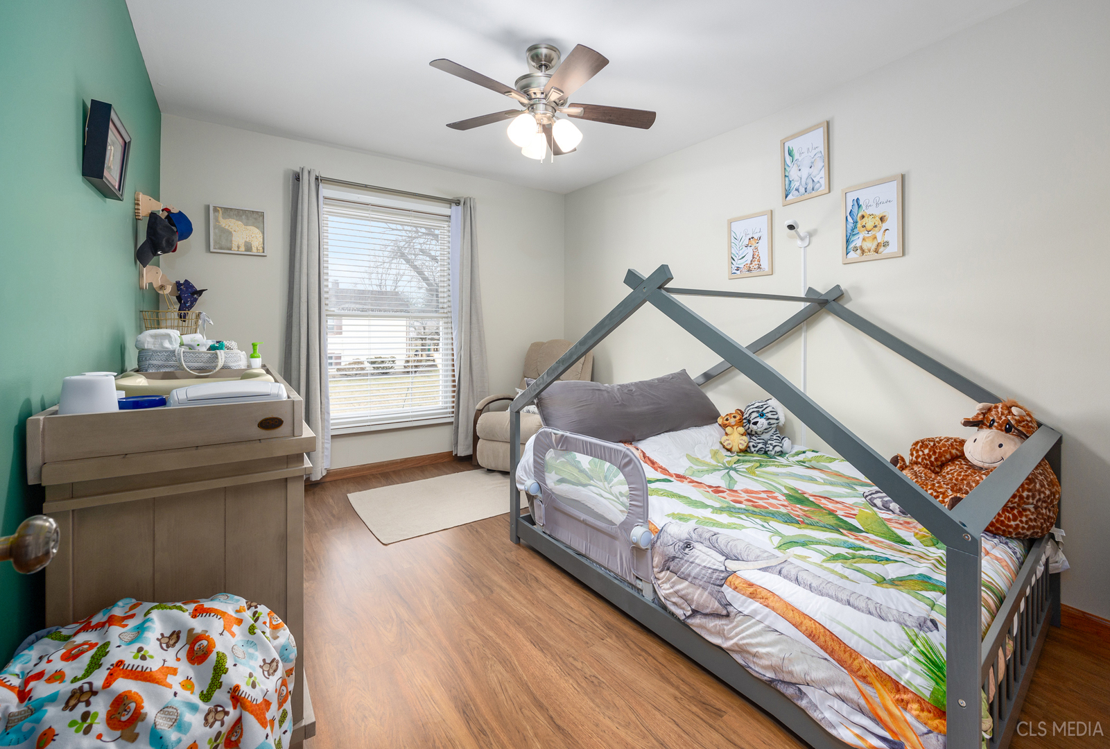 2115 Tiffany Drive Schaumburg, IL 60193 - Photo 18 of 23 a bedroom with a bed and wooden floor