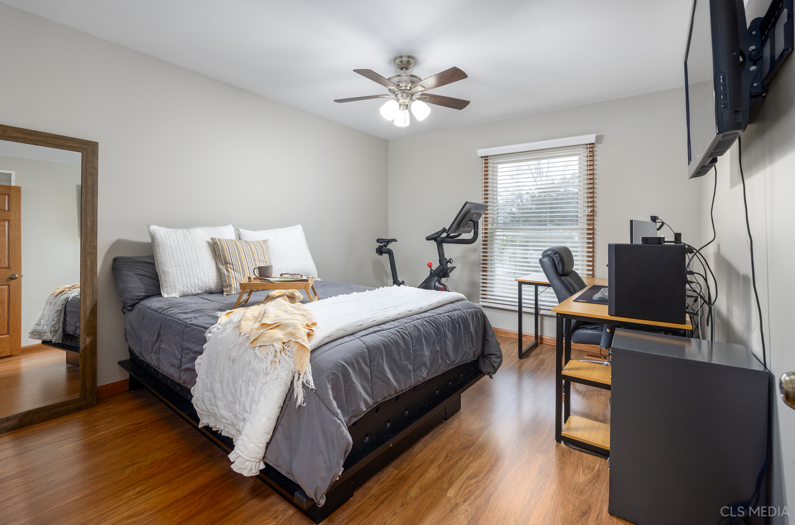 2115 Tiffany Drive Schaumburg, IL 60193 - Photo 20 of 23 a bedroom with a bed and wooden floor