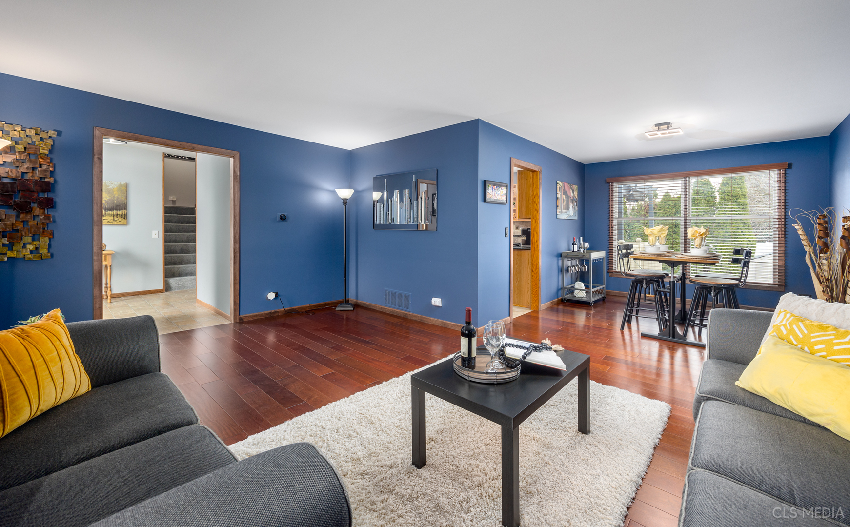 2115 Tiffany Drive Schaumburg, IL 60193 - Photo 4 of 23 a living room with furniture a rug and a large window