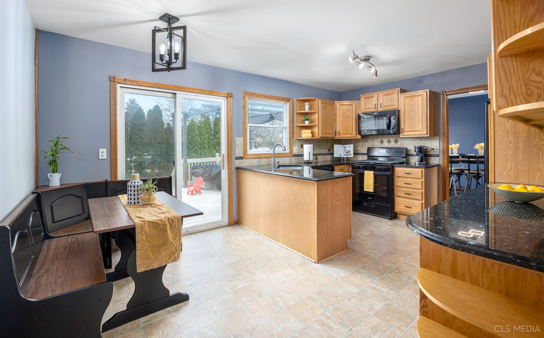 2115 Tiffany Drive Schaumburg, IL 60193 - Photo 7 of 23 a living room with stainless steel appliances granite countertop a sink a stove and a dining table with wooden floor
